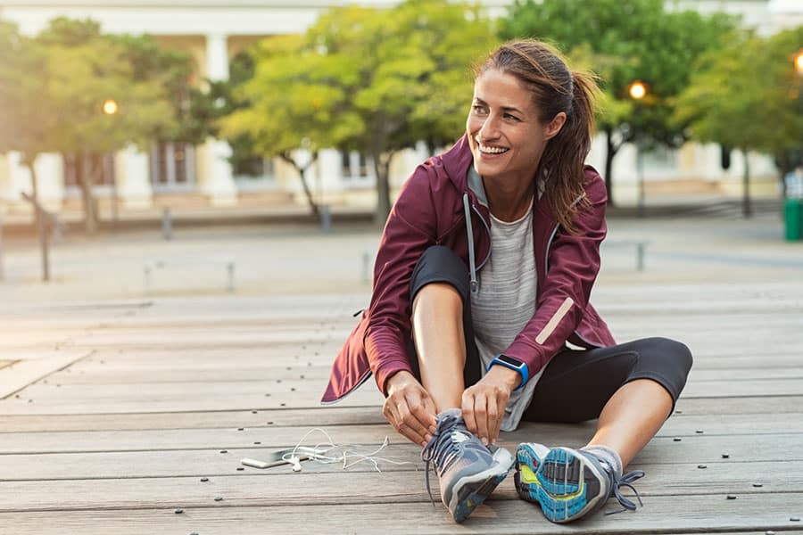 Woman Tying Shoes